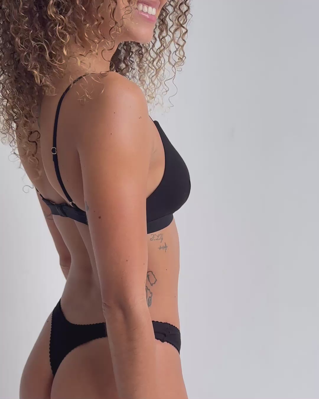 Video of model wearing flattering and comfortable  wireless triangle bralette in black bamboo natural fibre breathable fabric